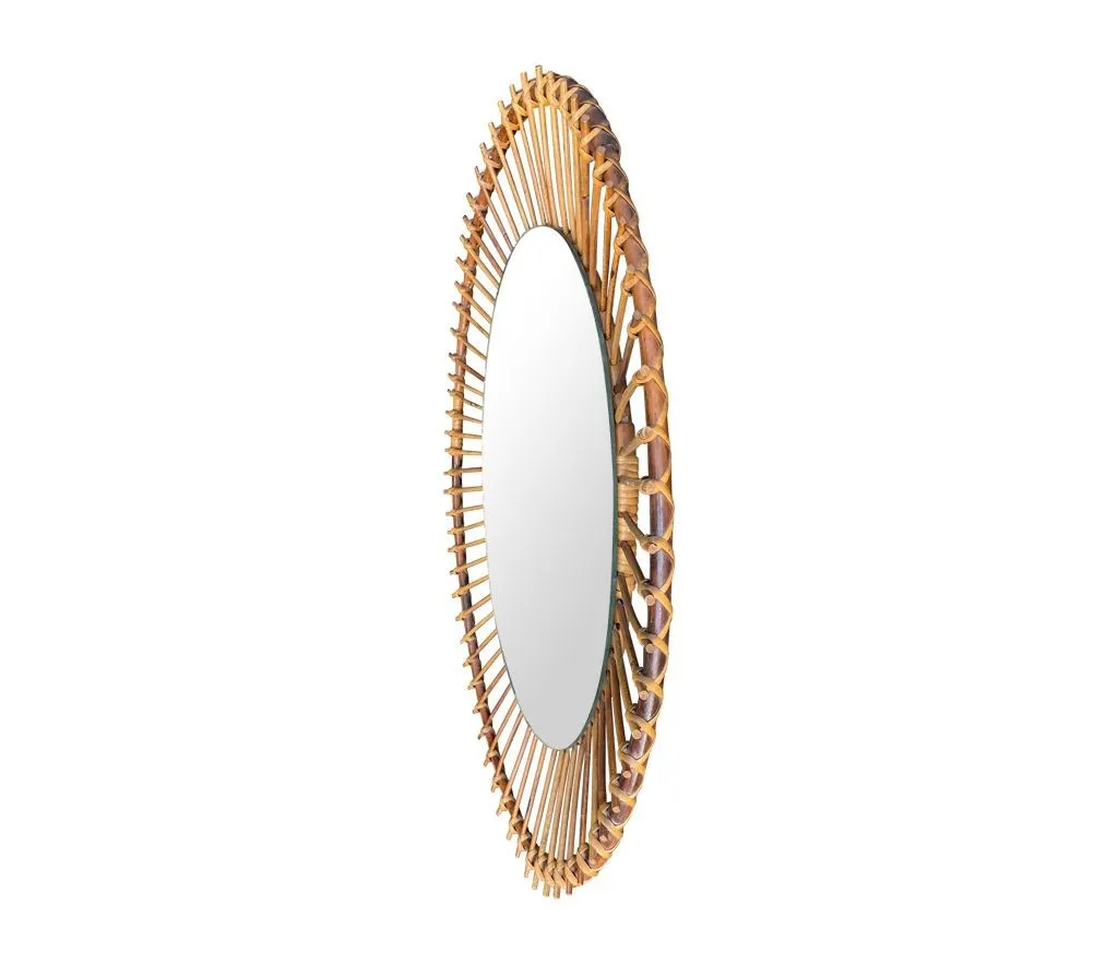 A 1970s Italian oval pencil reed bamboo mirror with original mirror plate fixed with brass circular fittings